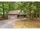 Charming home nestled amongst lush trees and mature landscaping and attached garage at 252 Fox Ridge, Pittsboro, NC 27312