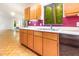 A kitchen featuring wooden cabinets, white countertops, and purple-painted walls at 252 Fox Ridge, Pittsboro, NC 27312