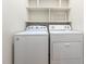 Laundry area featuring a white Whirlpool washing machine and a dryer at 252 Fox Ridge, Pittsboro, NC 27312