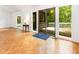 View of the living room with hardwood floors and sliding door access to the outdoor deck at 252 Fox Ridge, Pittsboro, NC 27312