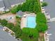 Aerial view of the community pool area surrounded by trees, providing a refreshing amenity at 2621 Asher View Ct, Raleigh, NC 27606