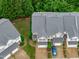 Aerial view of townhomes showcasing well-maintained roofs, landscaping, driveways, and parking at 2621 Asher View Ct, Raleigh, NC 27606