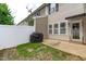 Back patio with grill and fenced yard, providing a private outdoor space at 2621 Asher View Ct, Raleigh, NC 27606