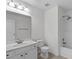 Bathroom featuring a sleek single vanity, toilet, and shower with white tile at 2621 Asher View Ct, Raleigh, NC 27606