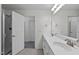 Bathroom with double sinks, large mirror, and a separate toilet and shower area at 2621 Asher View Ct, Raleigh, NC 27606