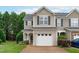 Charming townhome with neutral siding, attached garage, and well-maintained landscaping at 2621 Asher View Ct, Raleigh, NC 27606