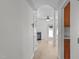 Hallway featuring stylish floors, neutral walls, and seamless transition to the living space at 2621 Asher View Ct, Raleigh, NC 27606