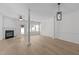 Living area with modern light fixture, fireplace, and hardwood flooring, perfect for entertaining at 2621 Asher View Ct, Raleigh, NC 27606