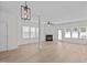 Bright and airy living room featuring a fireplace, neutral walls, and hardwood floors at 2621 Asher View Ct, Raleigh, NC 27606