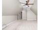The attic space features neutral walls, carpet flooring, and a ceiling fan at 3024 Weston Ct, Burlington, NC 27215