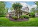Well-maintained backyard featuring a screened-in porch and mature landscaping at 3024 Weston Ct, Burlington, NC 27215
