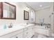 Elegant bathroom with double vanity, tub, and stylish fixtures at 3024 Weston Ct, Burlington, NC 27215