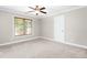 Bedroom featuring neutral walls, carpeting, a ceiling fan and a large window at 3024 Weston Ct, Burlington, NC 27215