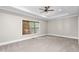 Spacious bedroom with neutral carpet and a large window with wooden blinds at 3024 Weston Ct, Burlington, NC 27215