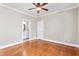 Bedroom with wood flooring, ceiling fan, and neutral colors at 3024 Weston Ct, Burlington, NC 27215