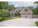Lovely home features a well-maintained lawn, professional landscaping, and inviting curb appeal at 3024 Weston Ct, Burlington, NC 27215