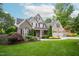 Charming home with a perfectly manicured lawn, mature landscaping, and inviting curb appeal at 3024 Weston Ct, Burlington, NC 27215