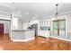 Open concept kitchen with a breakfast bar, stainless steel appliances, and a view to a dining area at 3024 Weston Ct, Burlington, NC 27215