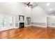 Open living room with fireplace, large windows, and vaulted ceiling at 3024 Weston Ct, Burlington, NC 27215
