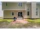 Back of home featuring a brick patio, grill, sliding glass door and siding at 304 Gold Point Dr, Cary, NC 27519