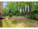Spacious backyard with a patio, grill, and lush green lawn at 304 Gold Point Dr, Cary, NC 27519
