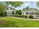 Exterior view of community building featuring manicured lawns and landscaping at 304 Gold Point Dr, Cary, NC 27519