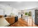 Modern kitchen with stainless steel appliances, wood floors, and an adjacent dining area with a sliding glass door at 304 Gold Point Dr, Cary, NC 27519