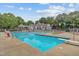 Bright, inviting community pool with marked lanes, lounge chairs, and festive decorations at 304 Gold Point Dr, Cary, NC 27519