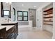 Bright bathroom featuring a shower, a tub, and wooden shelves at 306 Roebling Ln, Cary, NC 27513