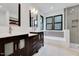 Bathroom featuring double vanities, a bathtub, and a glass-enclosed shower at 306 Roebling Ln, Cary, NC 27513