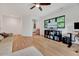 Large bedroom boasts hardwood floors, a ceiling fan, recessed lighting, and a nearby walk-in closet at 306 Roebling Ln, Cary, NC 27513