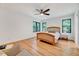 Spacious bedroom with hardwood floors and natural light from large windows at 306 Roebling Ln, Cary, NC 27513