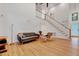 Cozy living room featuring hardwood floors and a staircase at 306 Roebling Ln, Cary, NC 27513