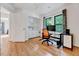 Bright office features hardwood floors, built-in storage, and a large window overlooking the backyard at 306 Roebling Ln, Cary, NC 27513
