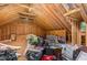 Unfinished attic featuring exposed beams, wood framing, and a variety of stored items at 3304 Black Stallion Ct, Zebulon, NC 27597