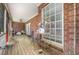 Cozy back porch area featuring brick exterior and ceiling fan providing a relaxed outdoor space at 3304 Black Stallion Ct, Zebulon, NC 27597