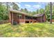 Brick house with screened back porch and patio in the backyard at 3304 Black Stallion Ct, Zebulon, NC 27597