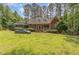 Picture of the charming brick home with landscaped lawn and mature trees at 3304 Black Stallion Ct, Zebulon, NC 27597