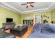 Living room featuring an olive green wall, white ceiling trim, and hardwood flooring at 3304 Black Stallion Ct, Zebulon, NC 27597