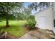 Backyard features a door to the home and a large lawn at 3519 Sugar Tree Pl, Durham, NC 27713