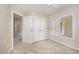 Bedroom with carpet, ceiling fan, closet and two mirrors at 3519 Sugar Tree Pl, Durham, NC 27713