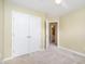 Bedroom with carpet, ceiling fan, closet and an ensuite bathroom door at 3519 Sugar Tree Pl, Durham, NC 27713