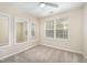 Bedroom featuring carpet, ceiling fan and two mirrors at 3519 Sugar Tree Pl, Durham, NC 27713
