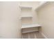 Organized walk-in closet offers shelving and a convenient built-in desk area at 3519 Sugar Tree Pl, Durham, NC 27713