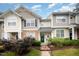 Charming townhome featuring manicured landscaping and inviting green front door at 3519 Sugar Tree Pl, Durham, NC 27713