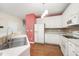 Bright kitchen features white appliances, white cabinets and eat in bar area at 3519 Sugar Tree Pl, Durham, NC 27713