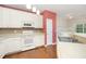 Well-lit kitchen features white cabinets, modern appliances, and counter with sink at 3519 Sugar Tree Pl, Durham, NC 27713