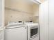 Laundry room features a modern washer and dryer with wire shelving above at 3519 Sugar Tree Pl, Durham, NC 27713