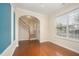 Inviting living room with hardwood floors, staircase, and natural light from the window at 3519 Sugar Tree Pl, Durham, NC 27713