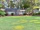 Charming brick home with a well-manicured lawn and mature trees offers great curb appeal at 3604 Woodlawn Rd, Rocky Mount, NC 27804